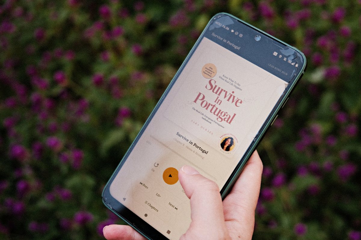 The Survive in Portugal audiobook playing on a phone